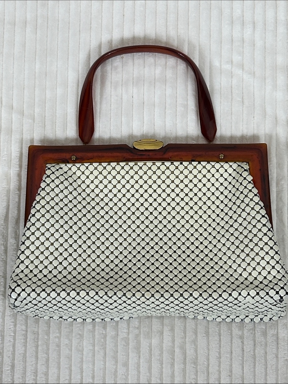 Vtg white enamel metal mesh and a structured brown tortoise Lucite handle purse